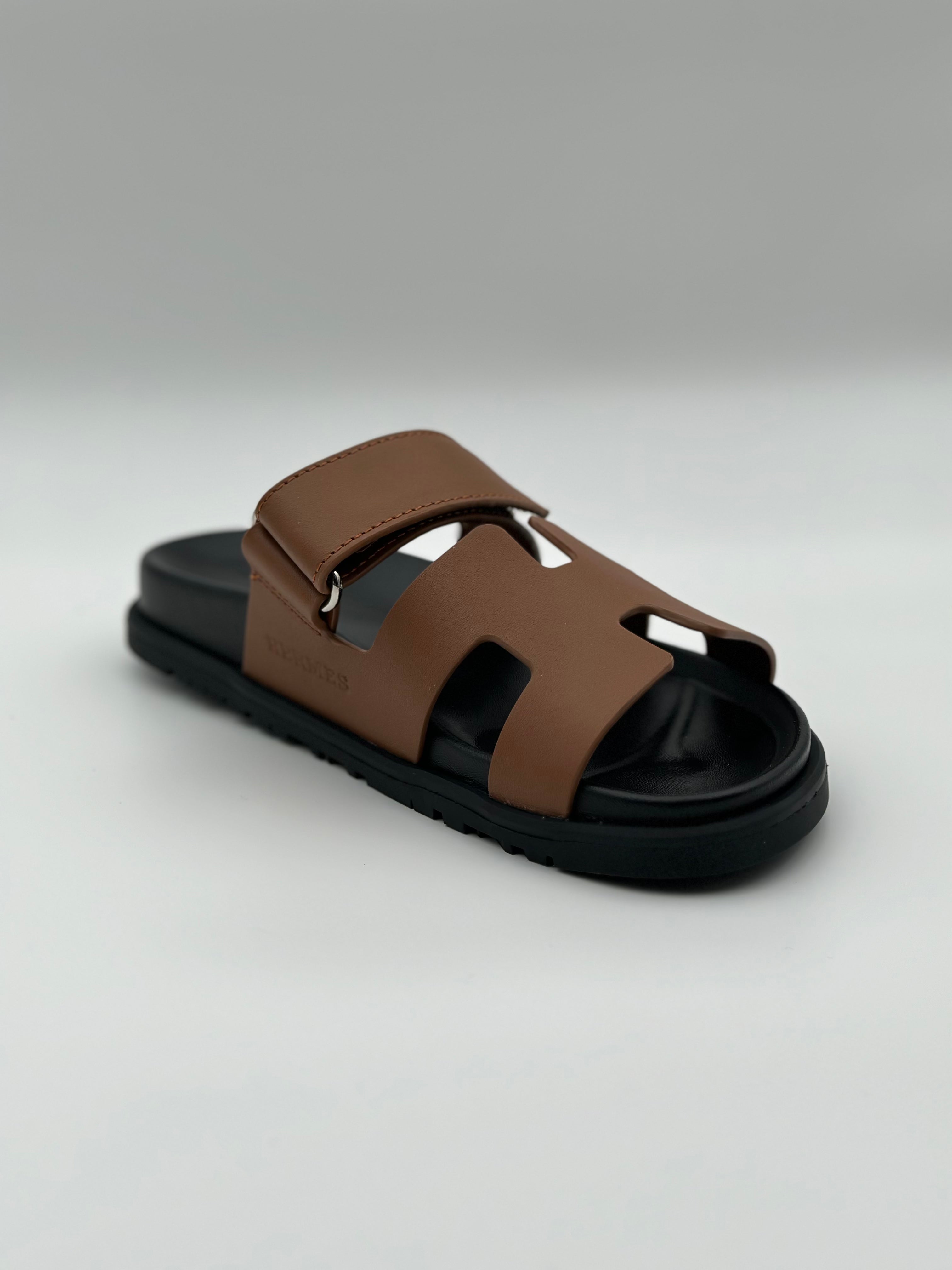 Hermes Chypre leather sandal " Black / Brown"